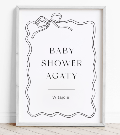 Tablica powitalna na Baby Shower z wstązką, kokarda. Czarno-biała, minimalistyczna, nowoczesna.